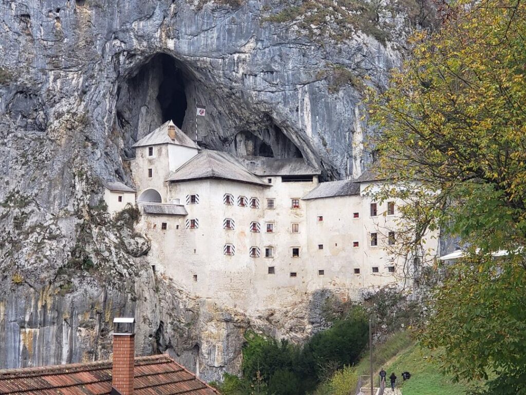 White Slovenian Castle built into a cave,